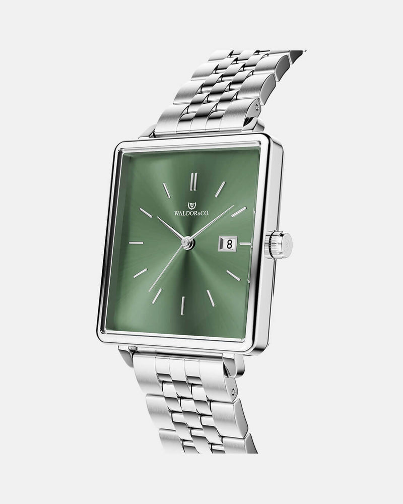 A square womens watch in silver from WALDOR & CO. with green sunray dial and a second hand. The model is Delight 32 Chelsea 28x32mm. 